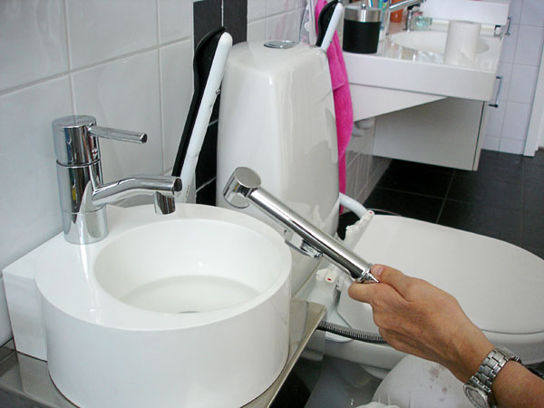 User with hand shower