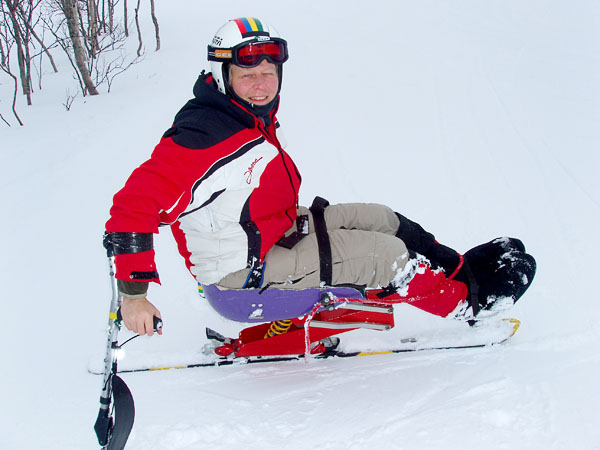 User on sit-ski