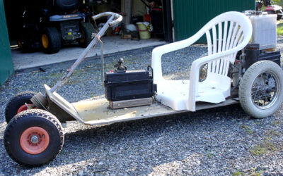 Go-cart with electric motor to trim flower beds