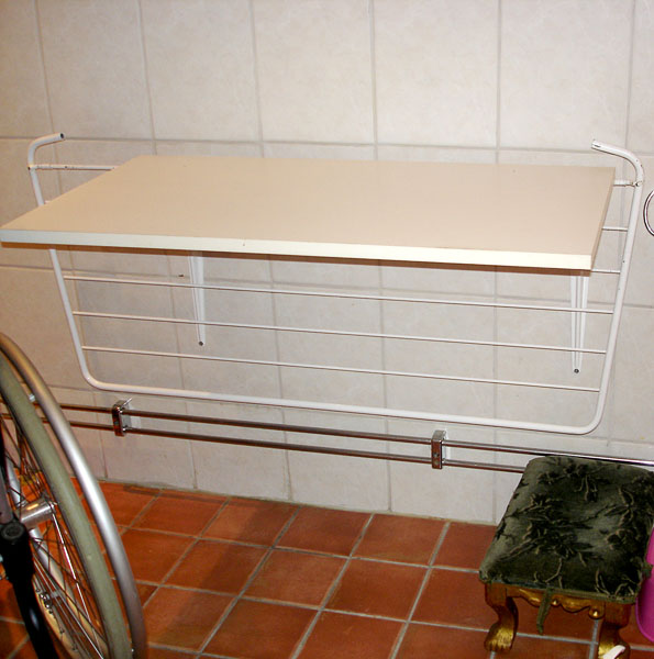 Wall-mounted counter (drying rack folded down)