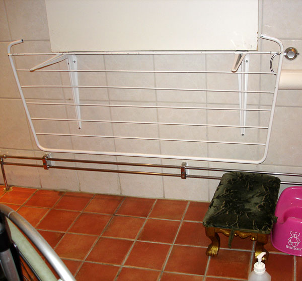 Counter folded up, drying rack hanging from angle brackets