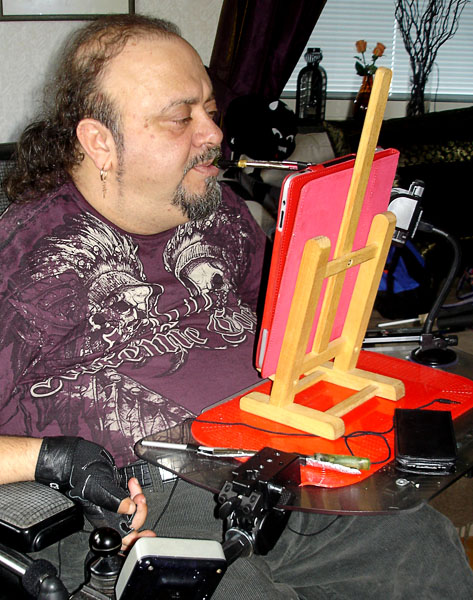User with iPad on table easel