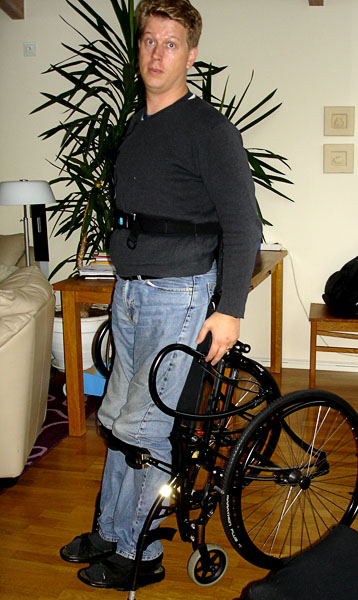 User standing in standing wheelchair
