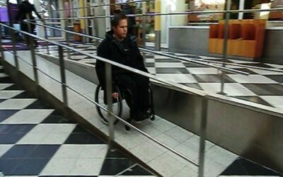 Go down an indoor ramp in a wheelchair