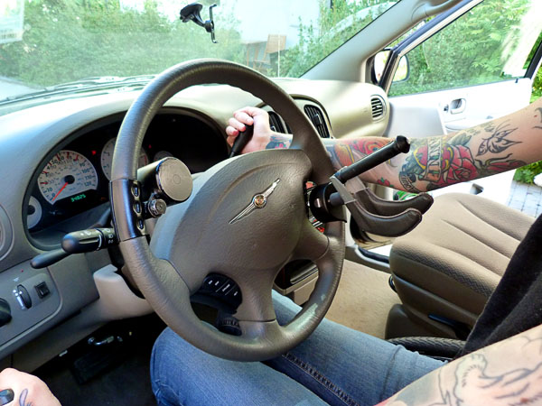 User holds the gear lever