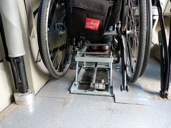 Mounting plate hooks into wheelchair
