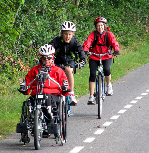 User riding bike with her children.