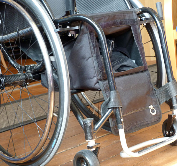Wheelchair bag mounted on the wheelchair (open)