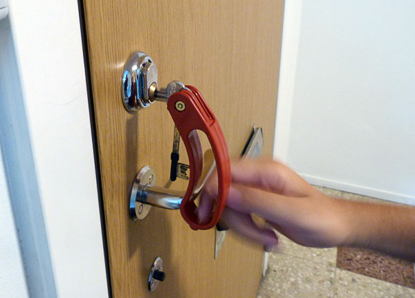 The user turns the key using the key holder