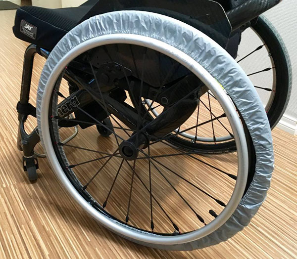 Wheel guard on wheelchair wheel. Photo from the user's archives