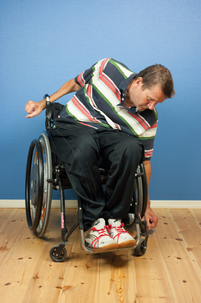 Lägesändra i rullstol: luta åt ena sidan